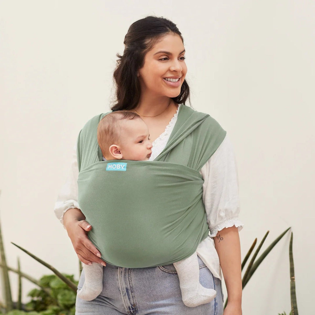 Woman carrying baby in a baby carrier